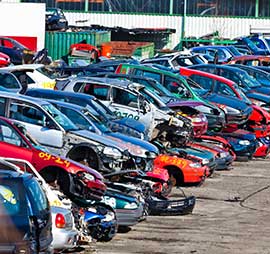 Auto wrecking yard showing cars stripped for parts