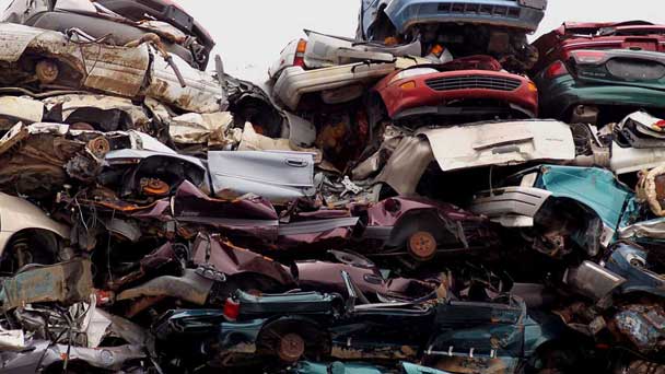 Different Junk Cars On A Scrapyard