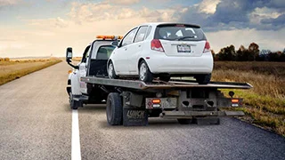 Car being towed away by car removal company.