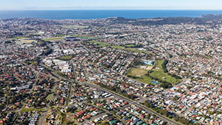 View from the air looking over Newcastle area including properties and coast.