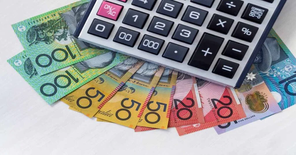 Calculator and money notes that were used to calculate the value of the car.