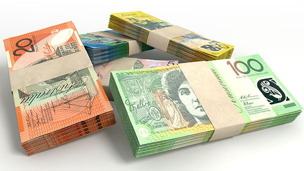 Bundles of Australian money, namely 100s, 50s, 20s and 10 dollar notes.