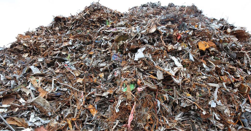 Large pile of scrap metal ready to be sorted and recycled