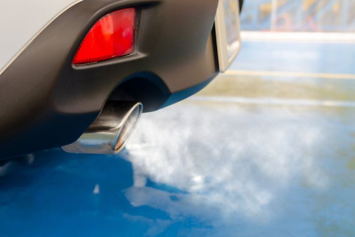 A car pipe emitting white smoke.